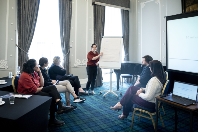 People chatting at a meeting